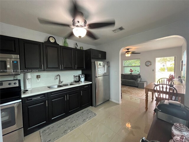 kitchen with sink and appliances with stainless steel finishes