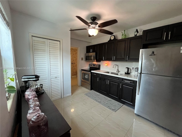 kitchen with ceiling fan, sink, and appliances with stainless steel finishes