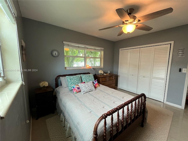 bedroom featuring ceiling fan and a closet