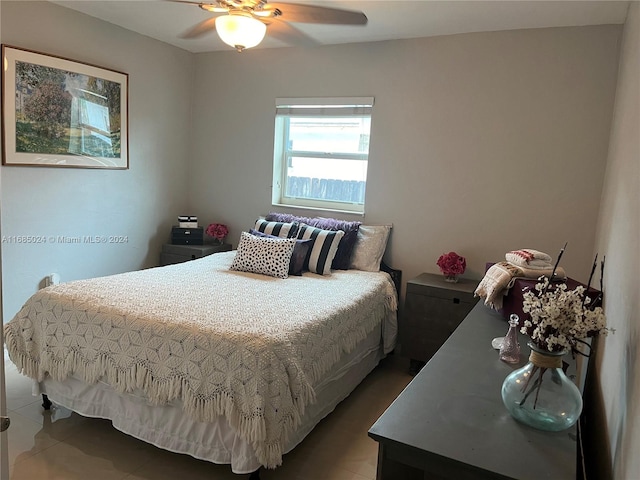 bedroom featuring tile patterned floors and ceiling fan