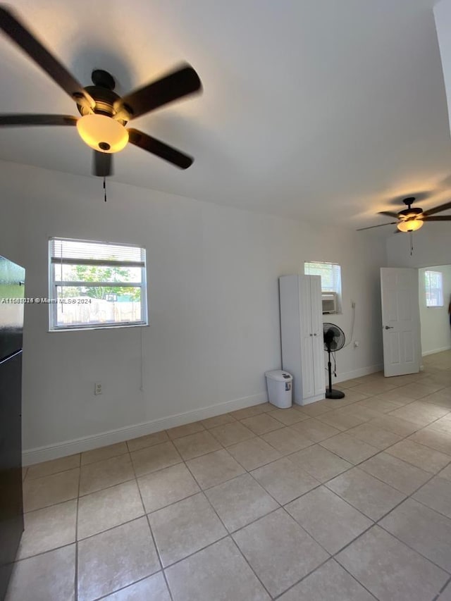 spare room with light tile patterned floors