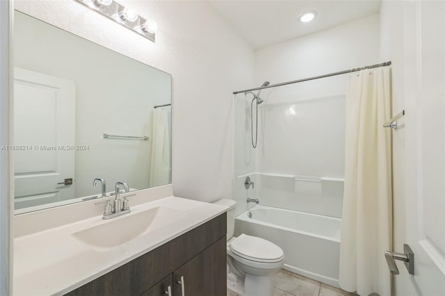 full bathroom with tile patterned floors, vanity, toilet, and shower / bath combination with curtain