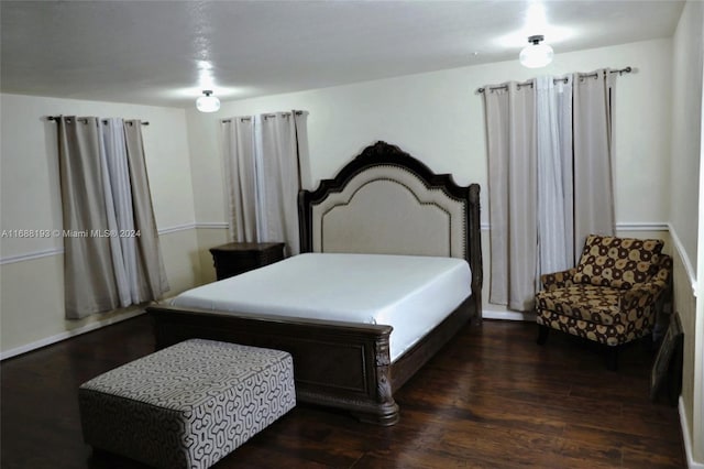 bedroom featuring dark hardwood / wood-style floors