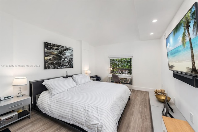 bedroom featuring dark wood-type flooring