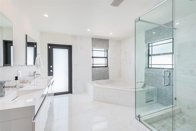 bathroom featuring vanity and plus walk in shower