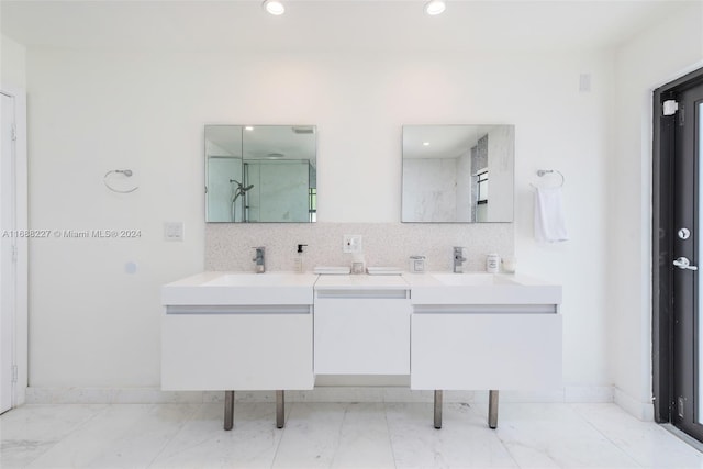 bathroom featuring walk in shower, vanity, and backsplash