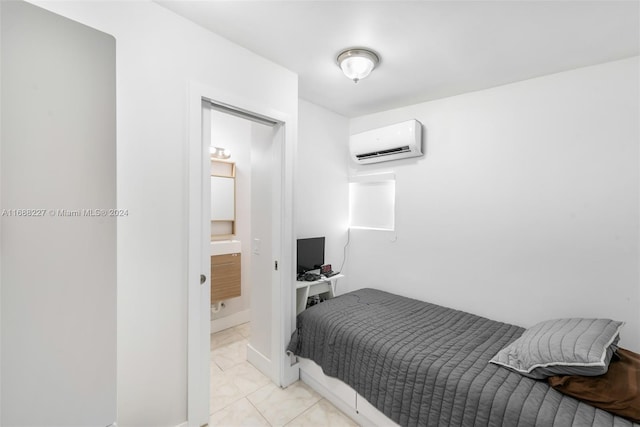 tiled bedroom with an AC wall unit and ensuite bathroom