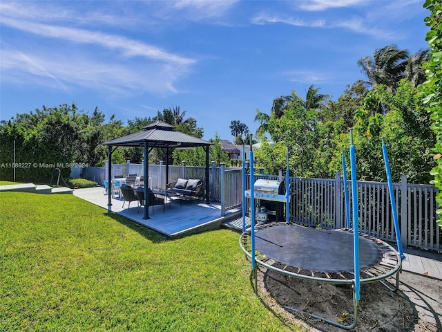 exterior space featuring a trampoline, a gazebo, outdoor lounge area, and a playground