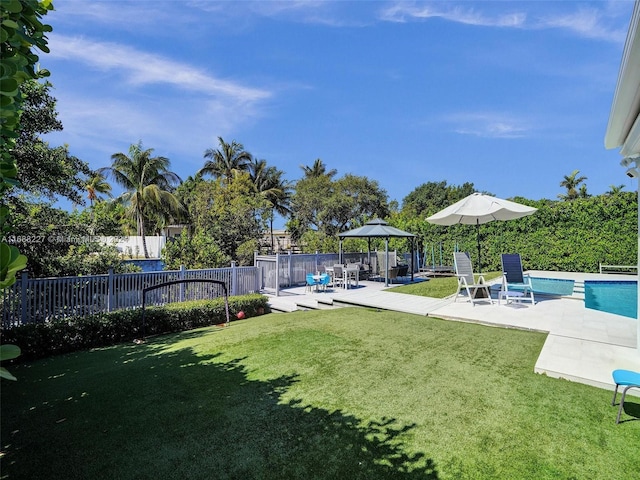 view of yard with a gazebo, a fenced in pool, and a patio