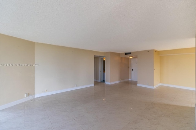 empty room with a textured ceiling