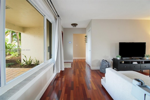 hallway with dark hardwood / wood-style flooring