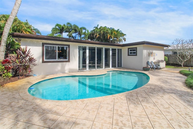 view of swimming pool with a patio