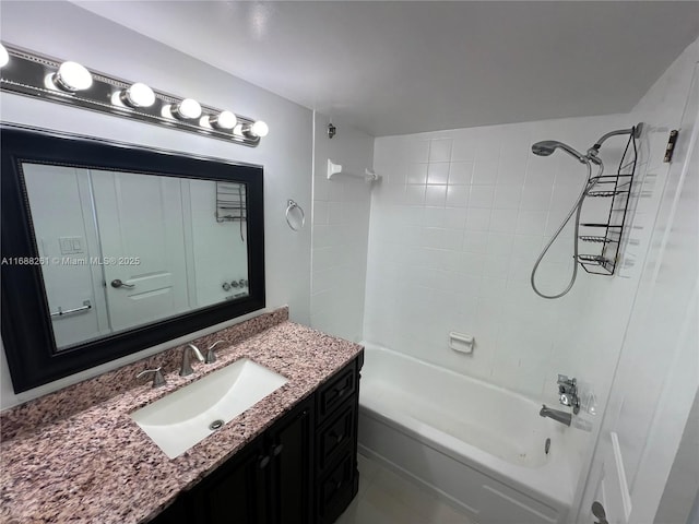 bathroom with vanity and tiled shower / bath combo