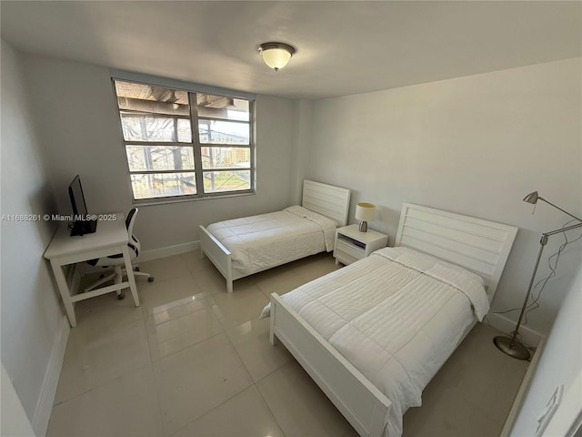 bedroom with light tile patterned flooring