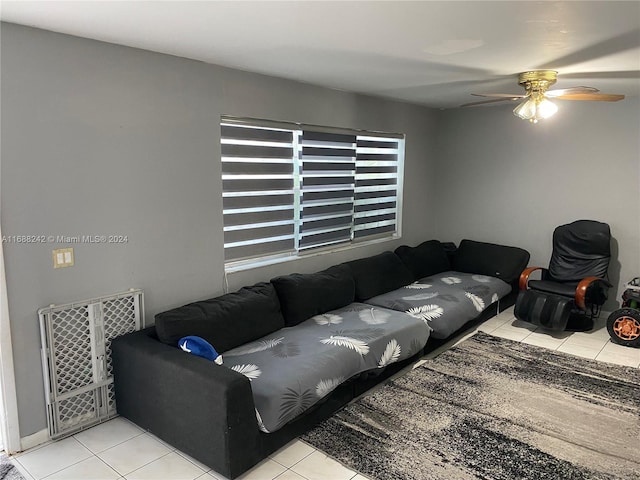 tiled living room featuring ceiling fan