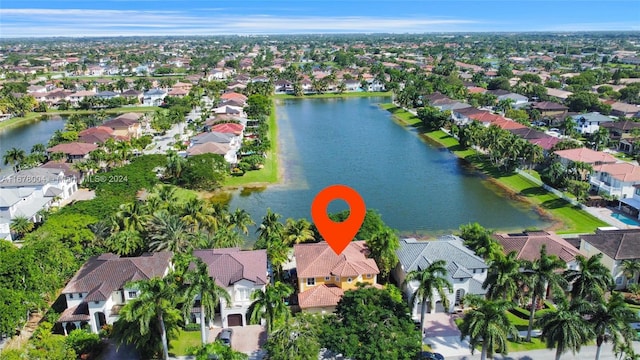 bird's eye view with a water view and a residential view