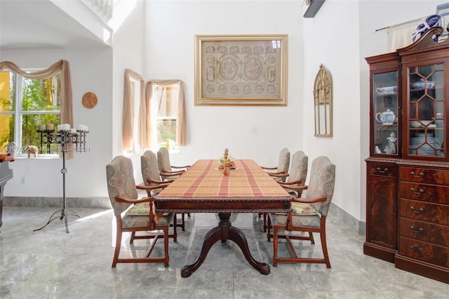 dining area featuring baseboards