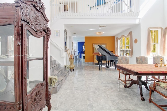 interior space with stairs and a high ceiling
