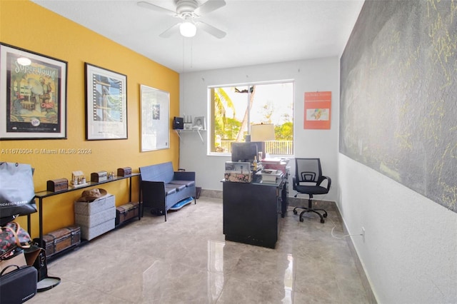 home office with baseboards and a ceiling fan