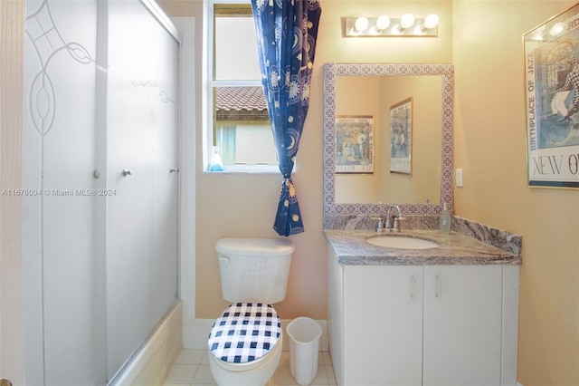 full bathroom with toilet, washtub / shower combination, vanity, and tile patterned floors