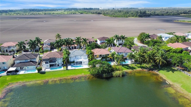 bird's eye view with a water view and a residential view