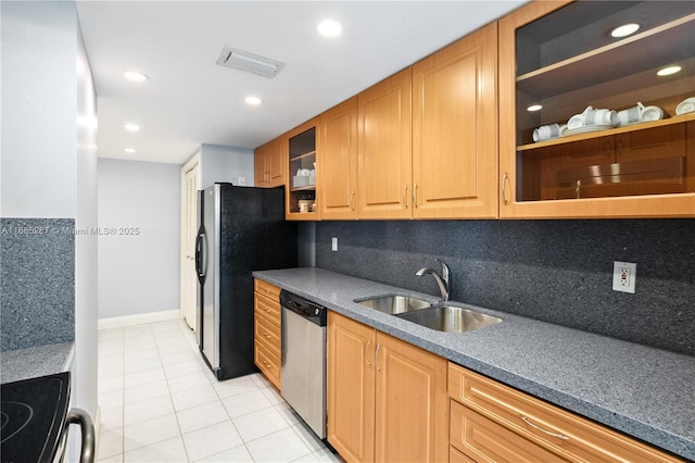 9801 Collins Ave Unit 18H, Bal Harbour, FL 33154 - kitchen with stainless steel dishwasher, a sink, freestanding refrigerator, light tile patterned floors, and glass insert cabinets