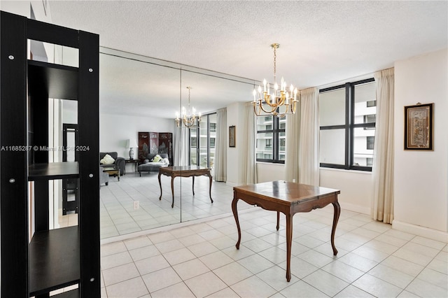 dining room with a notable chandelier, a textured ceiling, and light tile patterned flooring