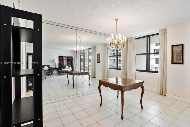 9801 Collins Ave Unit 18H, Bal Harbour, FL 33154 - dining room with a chandelier, baseboards, a textured ceiling, and light tile patterned floors