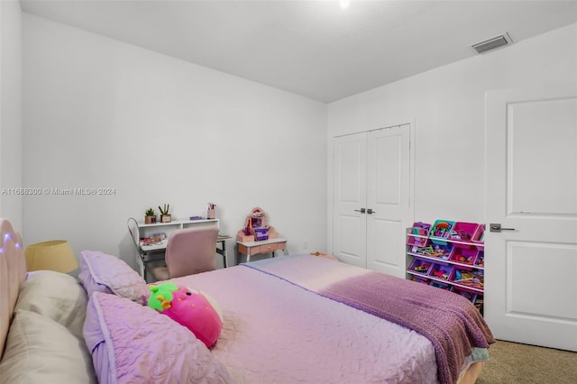 bedroom featuring a closet and carpet