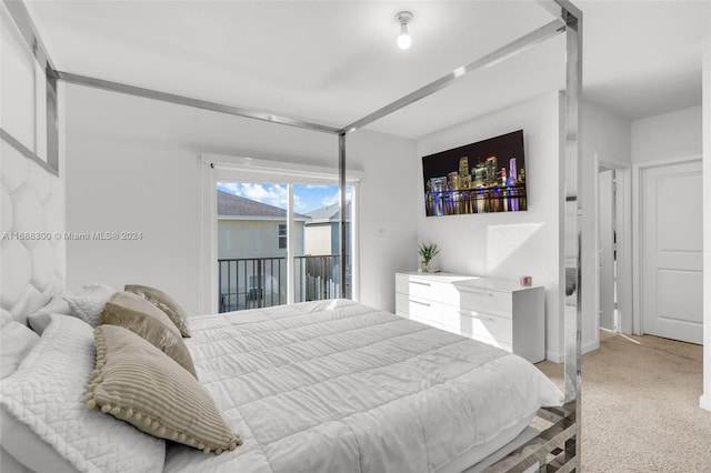 bedroom featuring carpet and access to outside