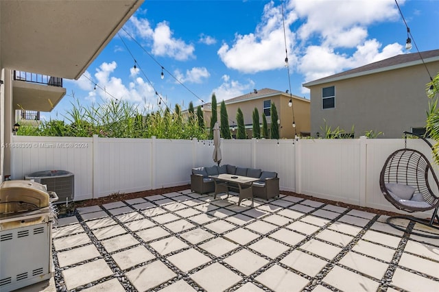 view of patio featuring cooling unit and an outdoor living space