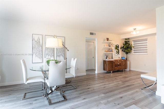 dining room with light hardwood / wood-style flooring