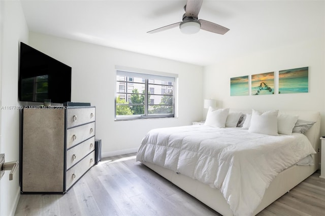 bedroom featuring ceiling fan and light wood-type flooring