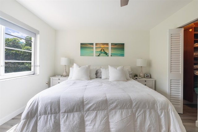 bedroom featuring wood-type flooring and ceiling fan