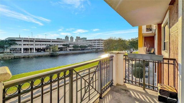 balcony featuring a water view