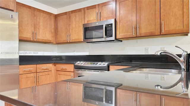 kitchen featuring sink and appliances with stainless steel finishes