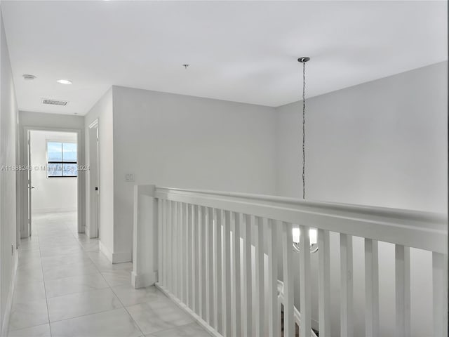 hall with light tile patterned flooring