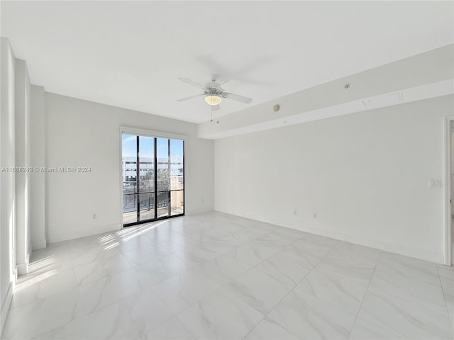 unfurnished room featuring ceiling fan