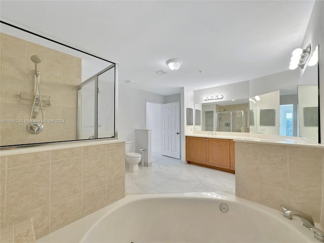 full bathroom with vanity, separate shower and tub, and toilet