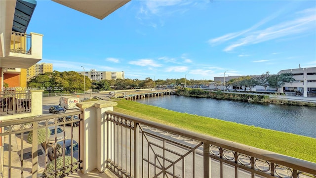 balcony featuring a water view