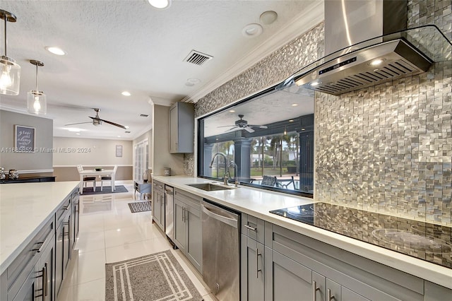 kitchen with gray cabinetry, dishwasher, wall chimney range hood, backsplash, and decorative light fixtures