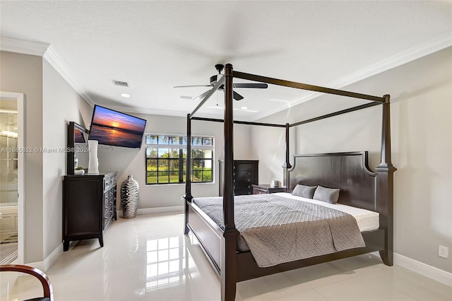 tiled bedroom featuring ensuite bath, ceiling fan, and ornamental molding