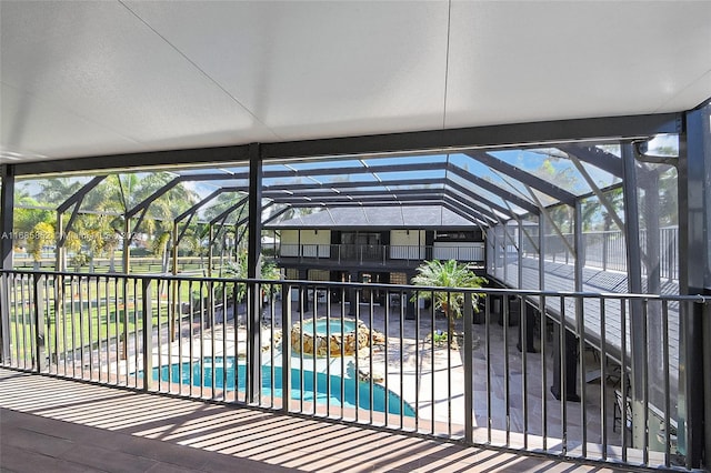 view of pool featuring a lanai, a patio area, and an in ground hot tub