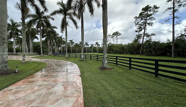 view of property's community with a lawn