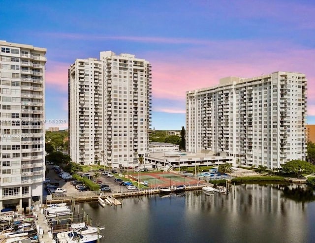 outdoor building at dusk featuring a water view