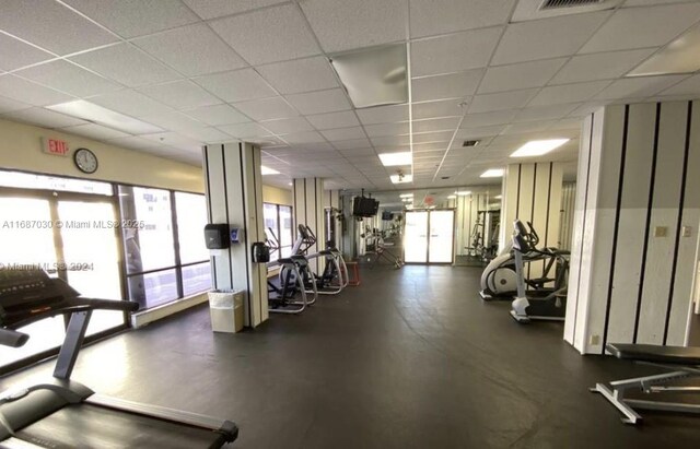 workout area featuring a drop ceiling