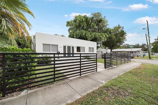 view of gate featuring a yard