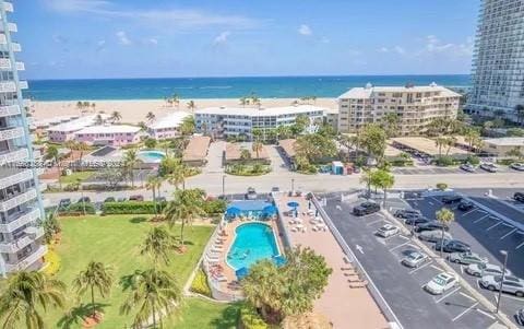 bird's eye view featuring a water view and a view of the beach