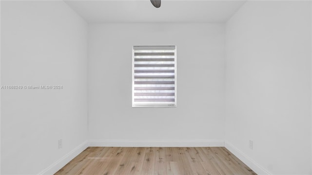 unfurnished room with light wood-type flooring