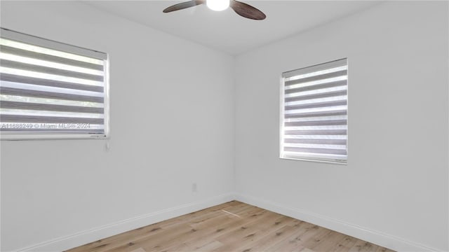 spare room with light hardwood / wood-style floors and ceiling fan